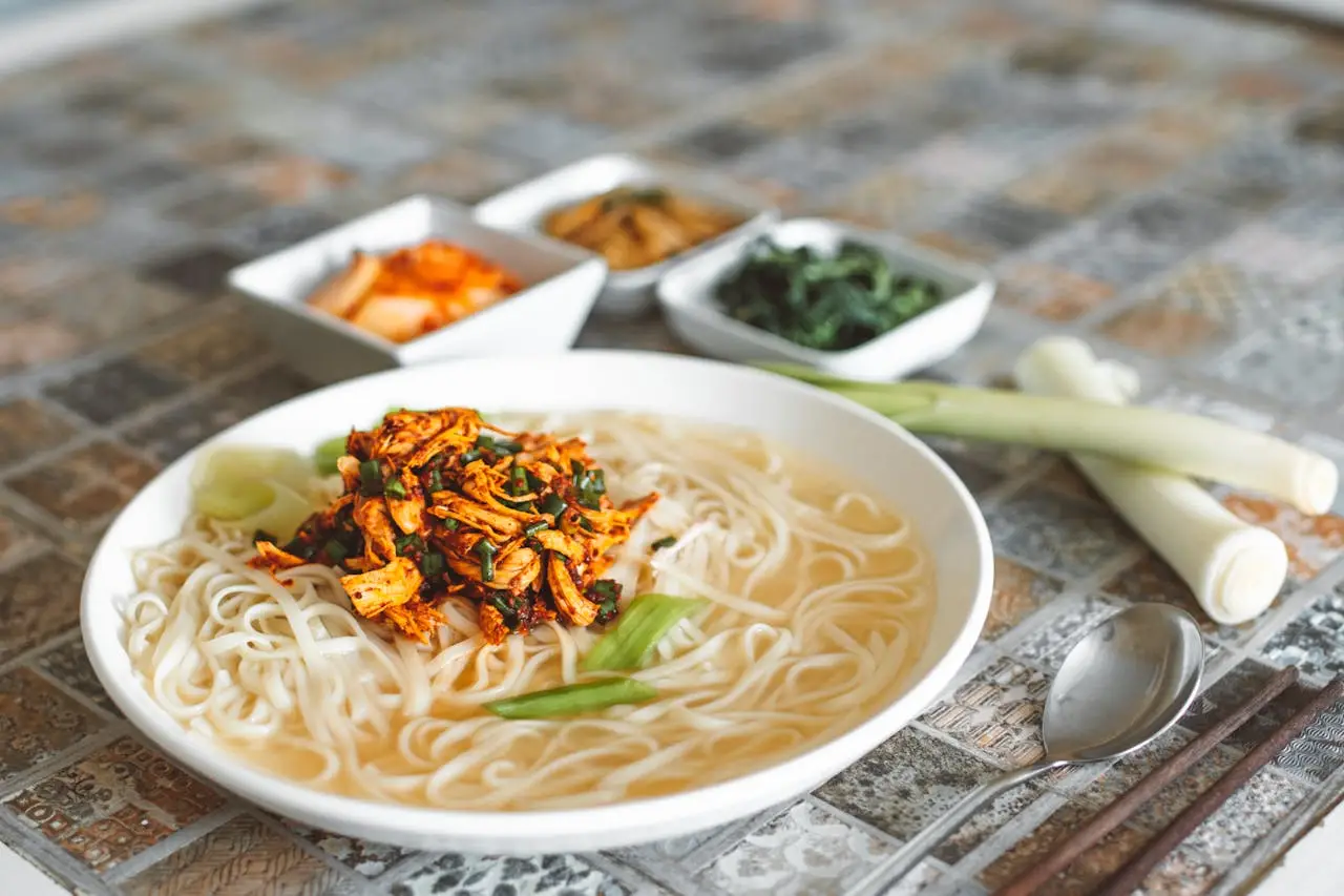 A Bowl of Noodles and Onion Leeks